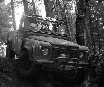 Land Rover Defender 110 in woods on challenge event
